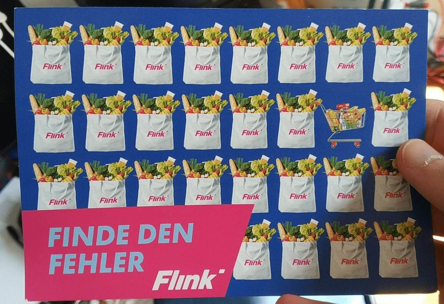 Werbe-Postkarte von Flink mit dem Slogan 'Finde den Fehler'